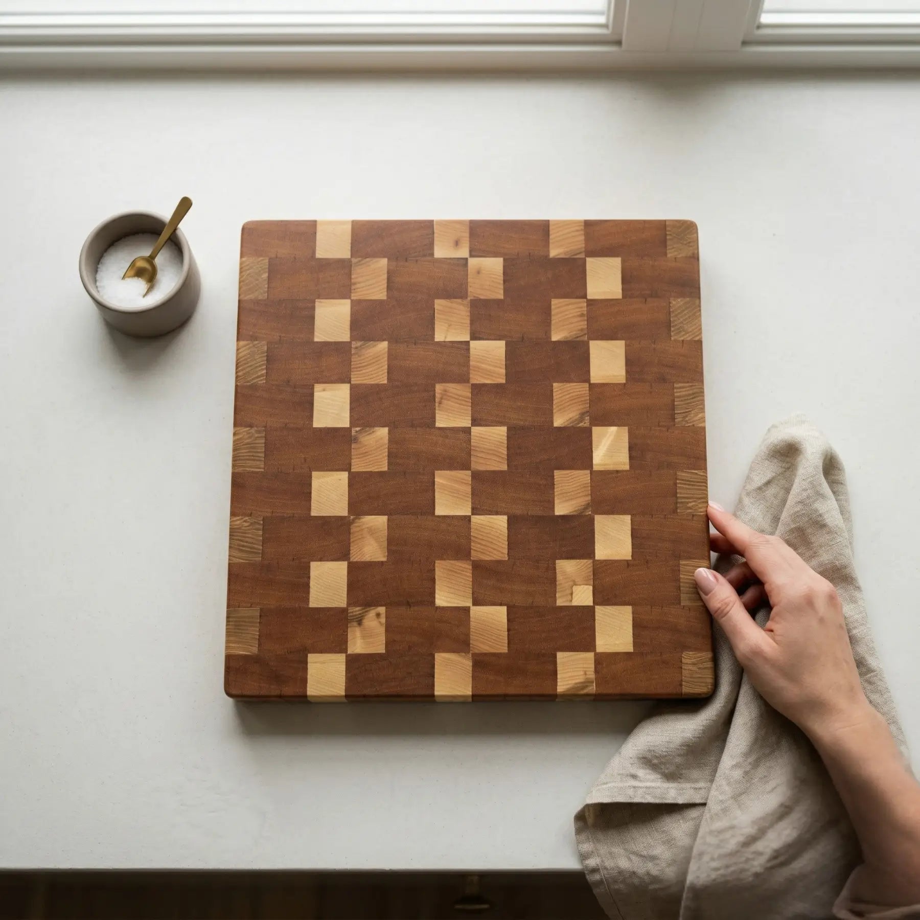 End grain wood cutting board 335x310 mm top down view showing the unique sapele and ash checkerboard pattern.