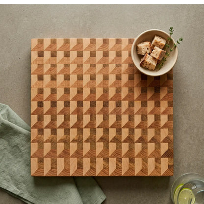 Close-up of three-wood weave pattern in ash, sapele and maple on handmade board