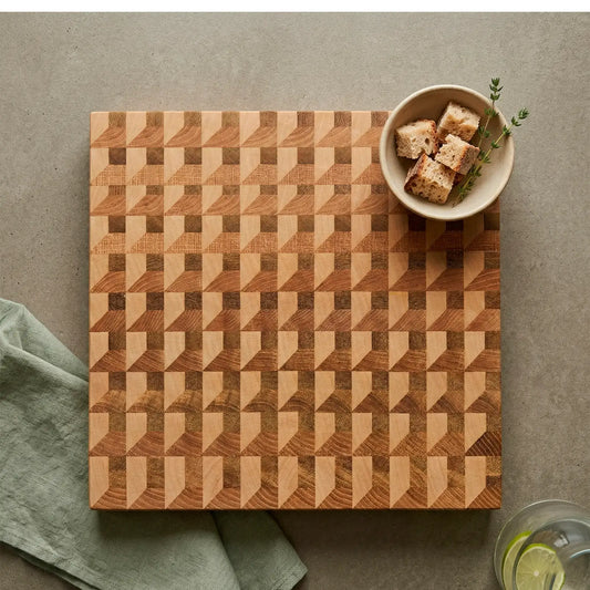 Close-up of three-wood weave pattern in ash, sapele and maple on handmade board