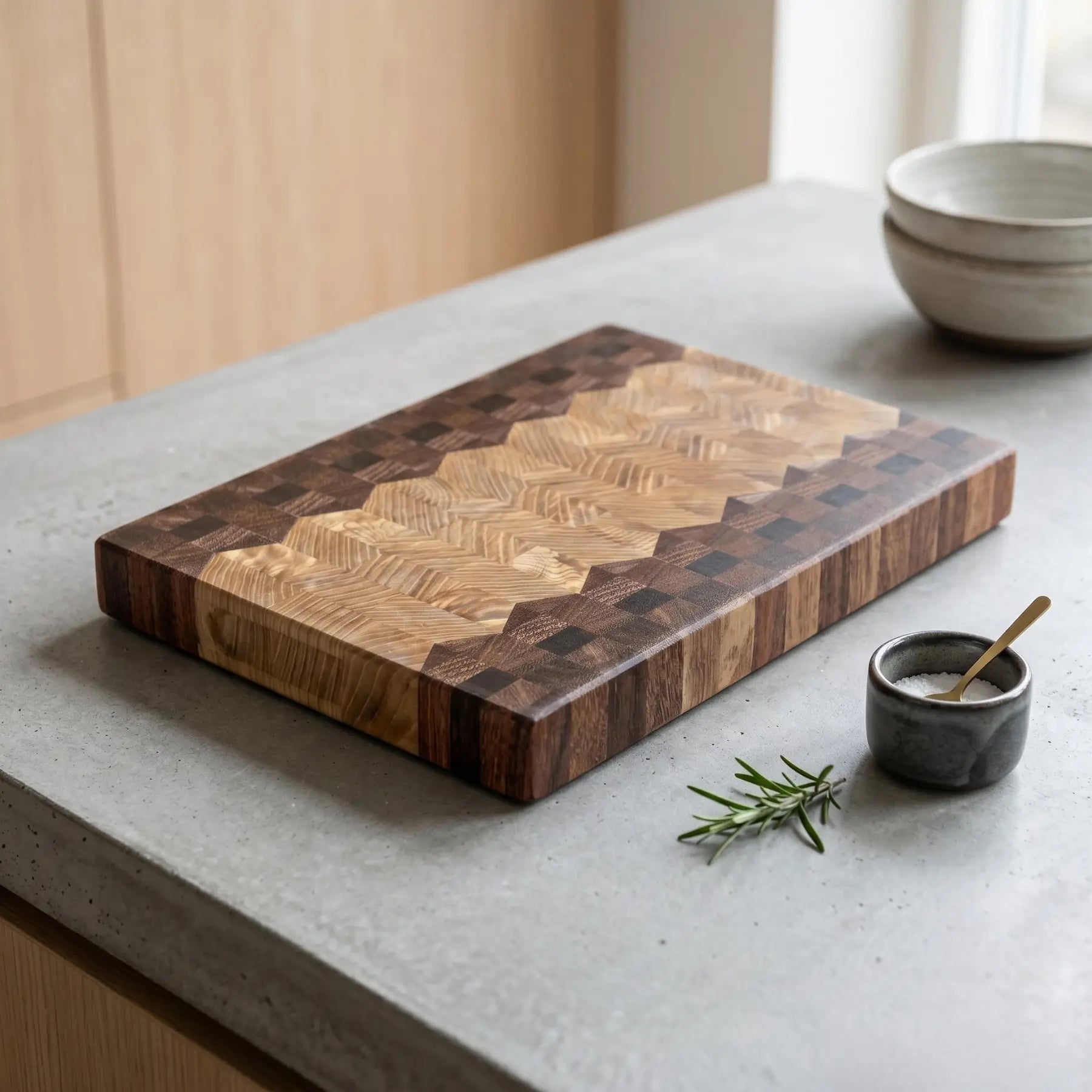 Dual pattern cutting board at angle showing two distinct end-grain sections
