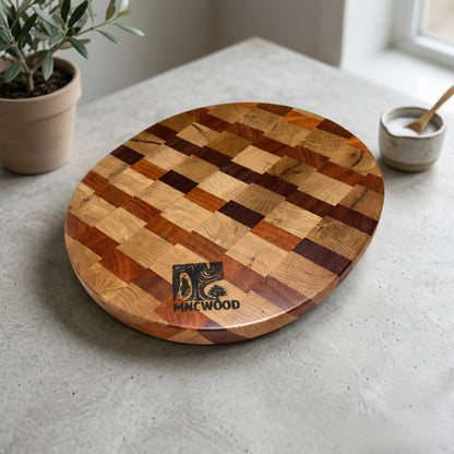 Solid ash and sucupira butcher block 350 mm styled on a light countertop with fresh cooking ingredients.