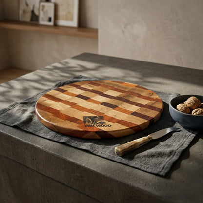 Premium circular wooden serving board 350 mm resting on a kitchen island surrounded by culinary tools.