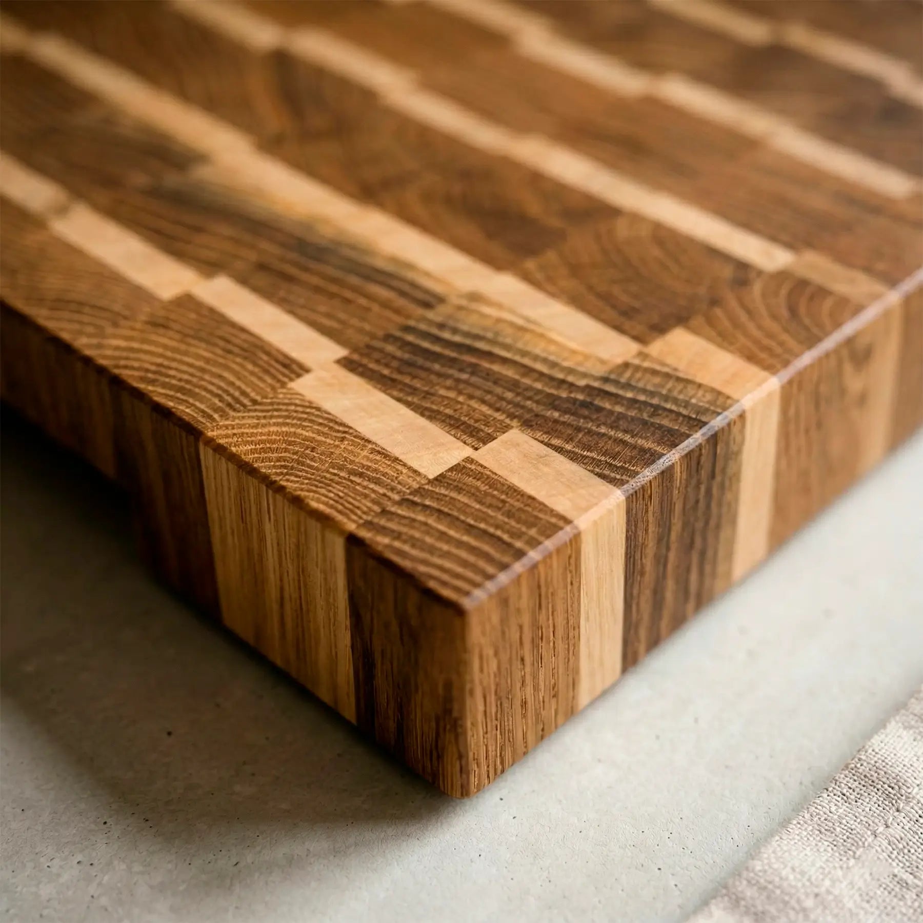 Close-up of two-tone ash and maple pattern on handmade end-grain board