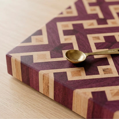 Rich violet tones of purpleheart wood on handmade end-grain cutting board