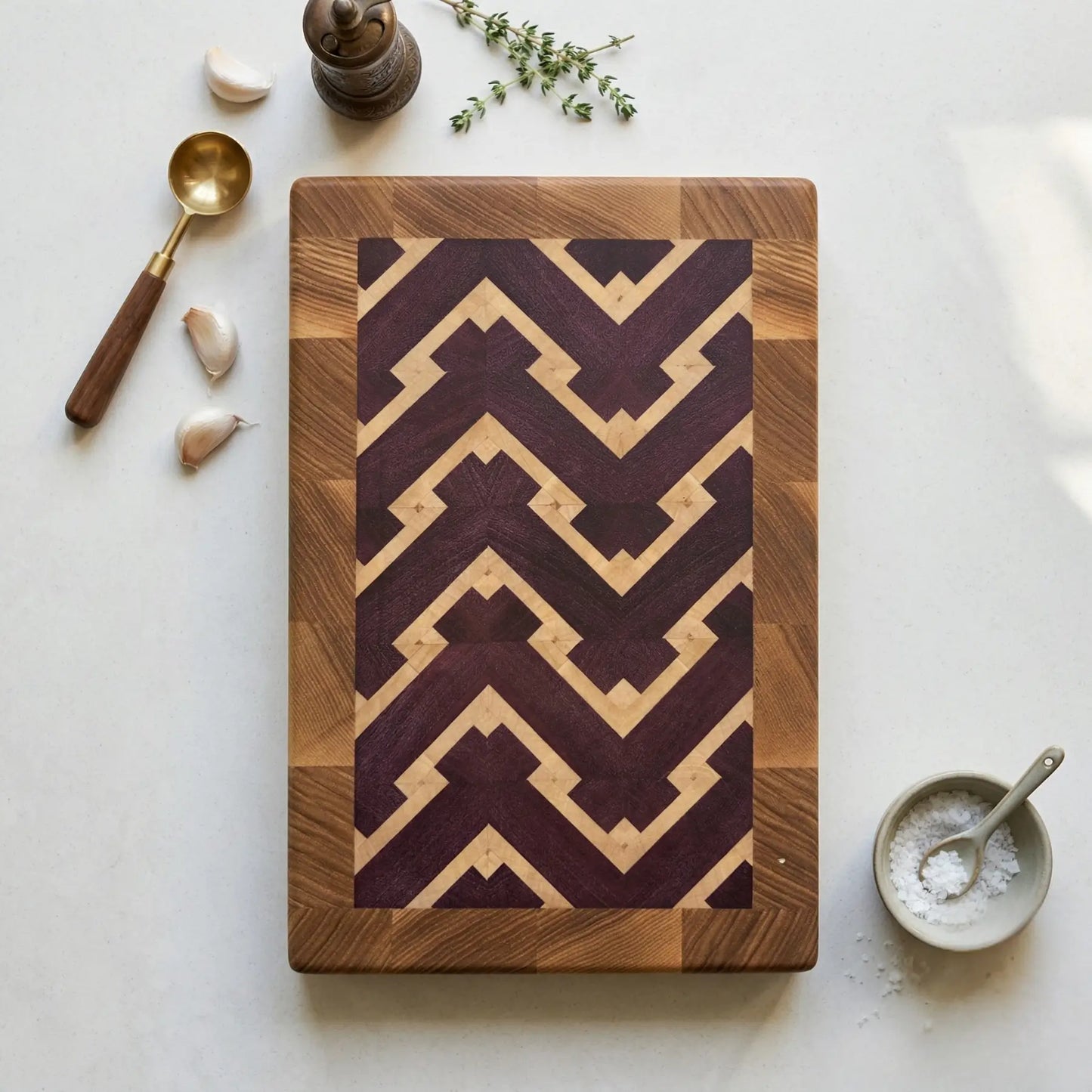 Small end-grain cutting board at angle showing V-shaped chevron pattern