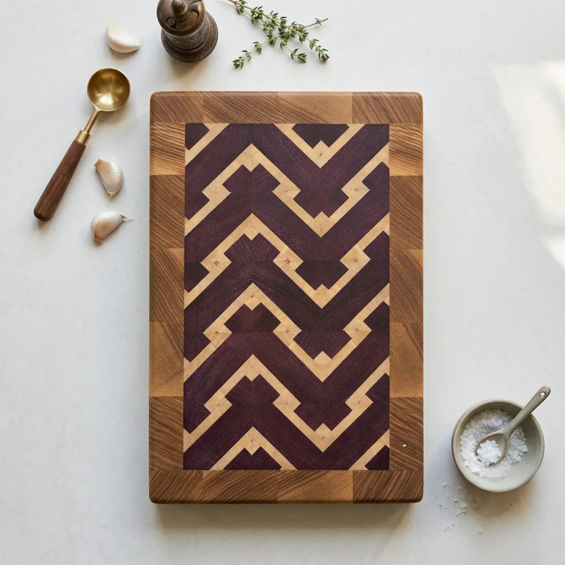 Small end-grain cutting board at angle showing V-shaped chevron pattern