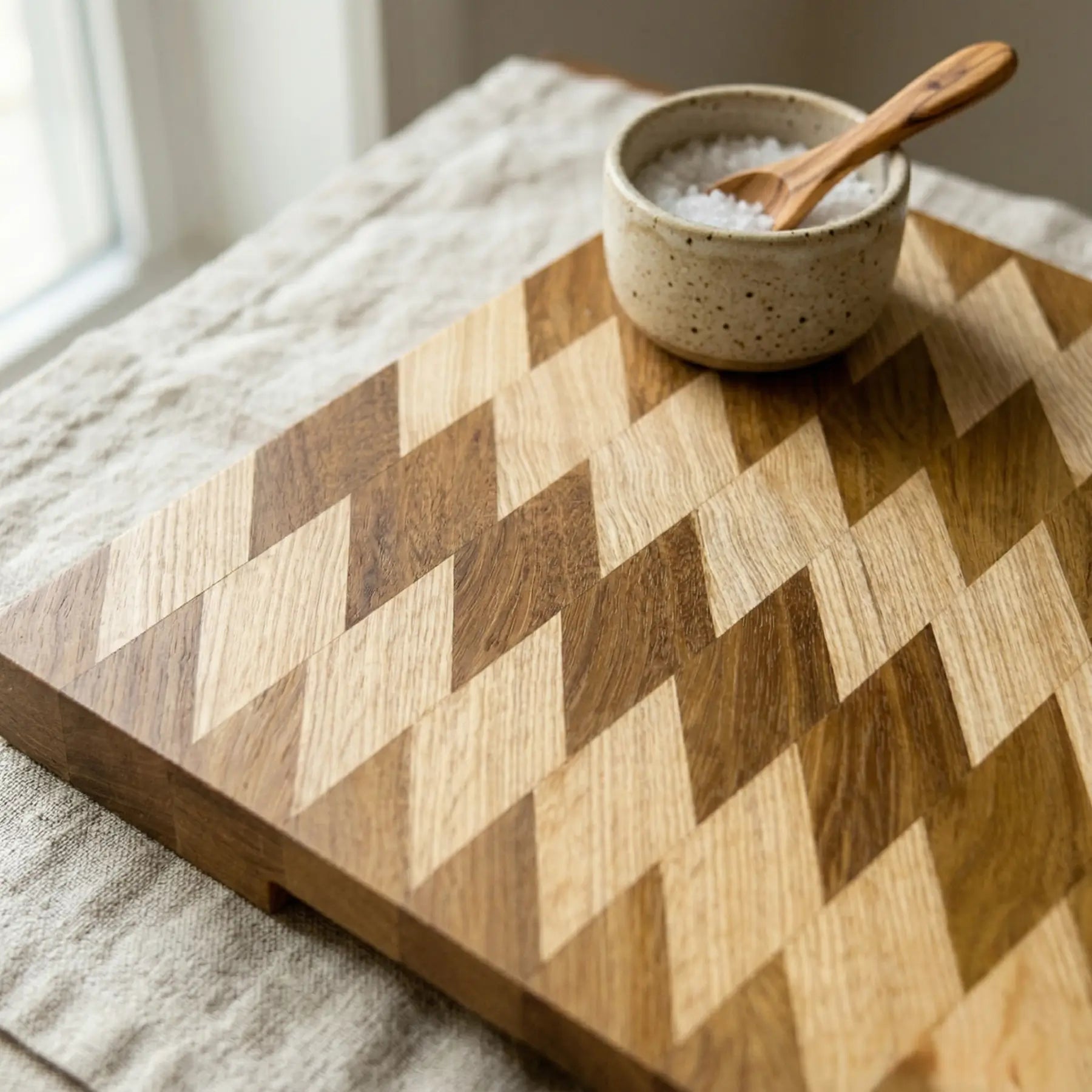 Thick wooden serving board 14.5x13.7 inch angled view highlighting the 40mm thickness and smooth rounded edges.