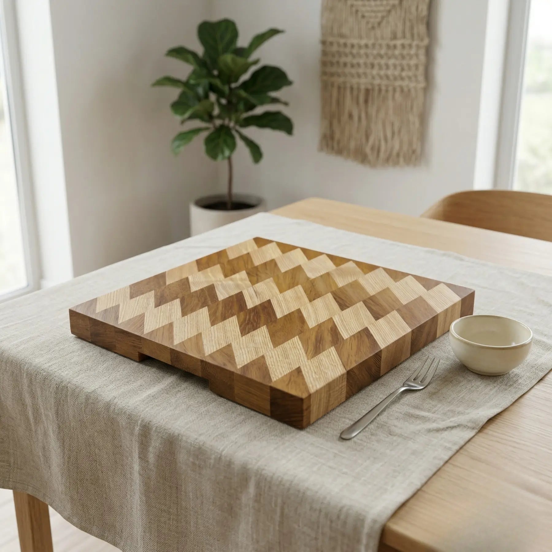 Heavy duty wood cutting board 370x350 mm used for slicing fresh ingredients on a light kitchen countertop.