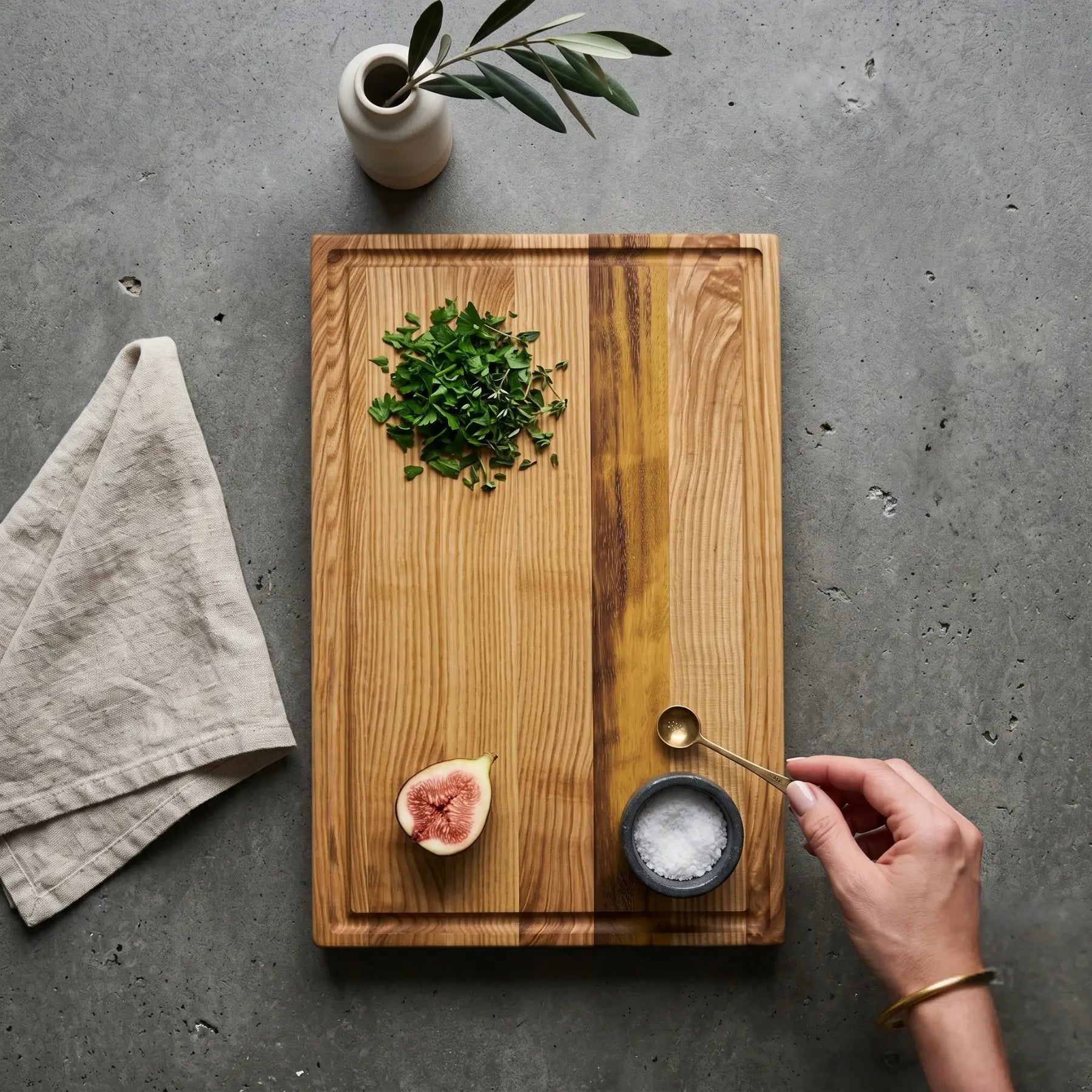 Large wooden cutting board with whole salmon side, serving lifestyle